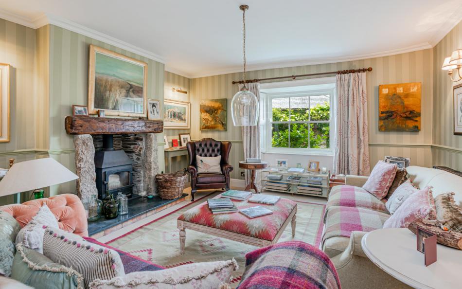 The seating area in the drawing room with log burner at Dunstone Farm