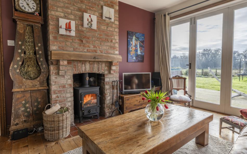 llunge with woodburner at at Heather Cottage