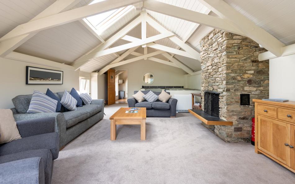 The large lounge, with open fire and feature window to admire the views over the estuary and village. at Farthingfield 