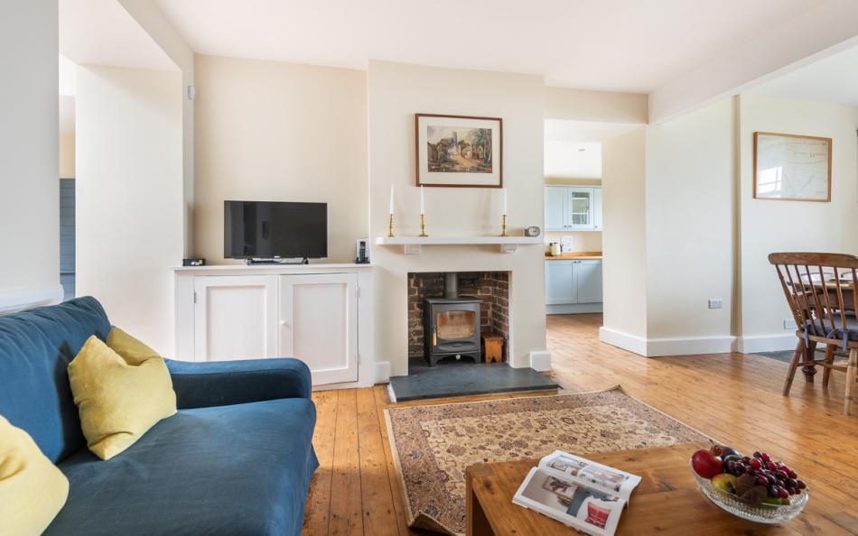lounge with log burner at 1 Ivy Cove