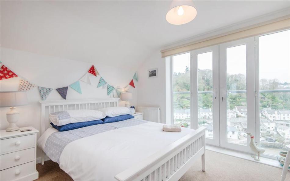 Beautiful master bedroom with waterside view at The Haven 