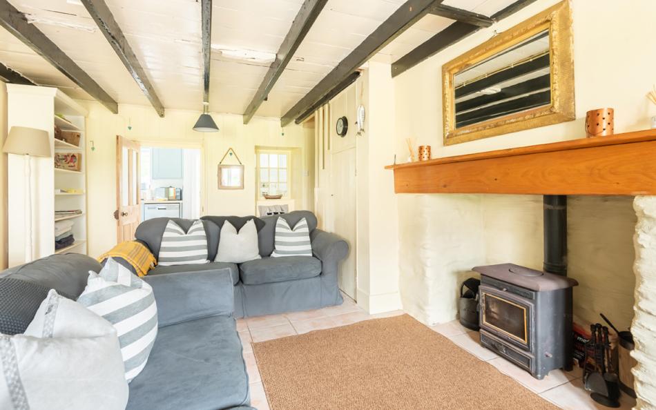 The lounge with log burner at Camac Cottage 