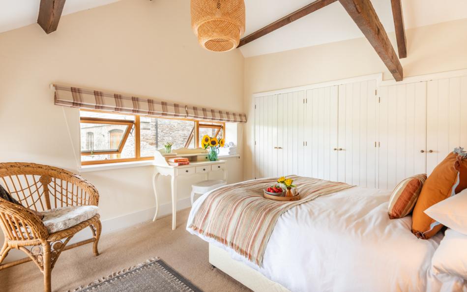 Bedroom 1 with exposed a-frames at Blackness Barn