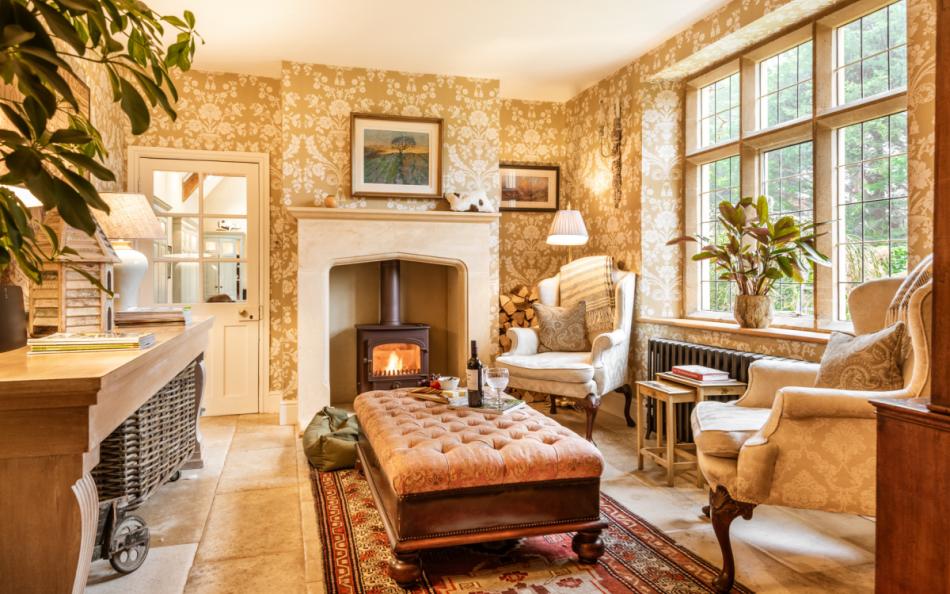 sofas by the fire at Brookside Lodge 