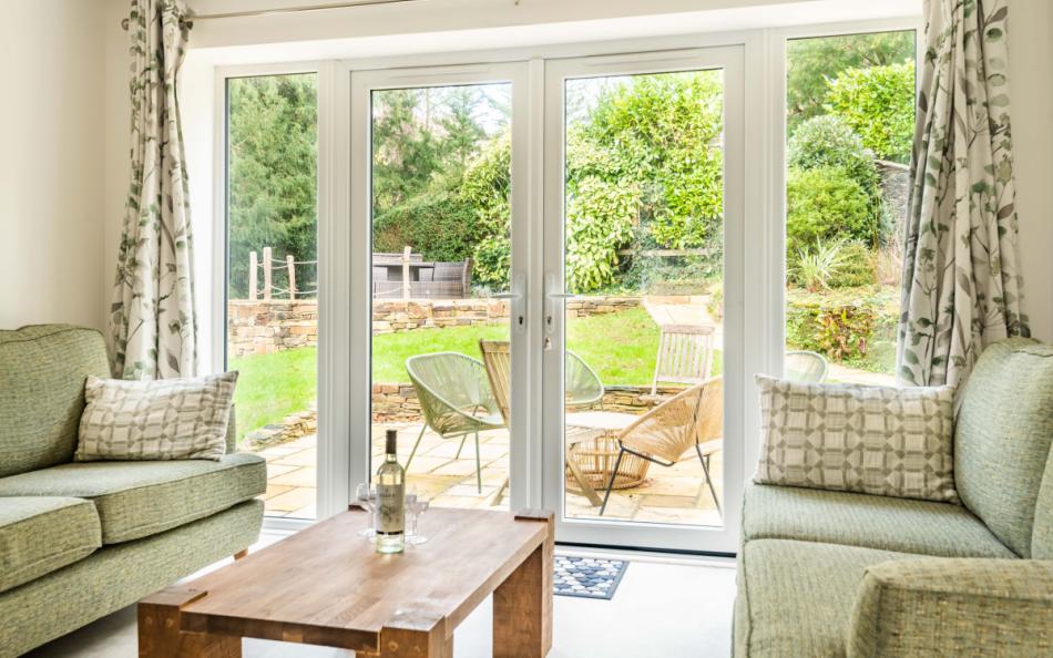 Doors to the outside space from the kitchen seating space at Clanacombe Lodge 
