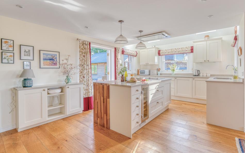 modern kitchen with island at Ivy Cottage