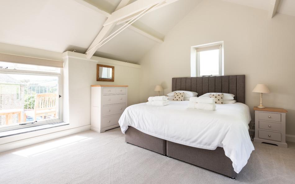 The master bedroom with views over the paddock to the rear at Farthingfield 