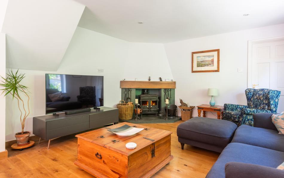Lounge with log burner at Oakdale 