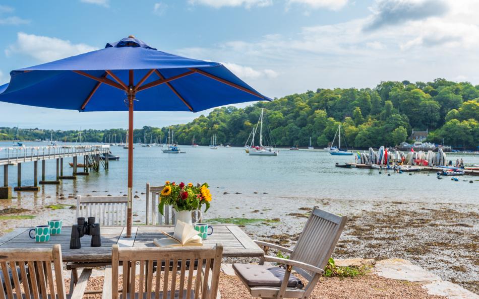 Stunning front patio beside the River Dart at Dunedin Cottage