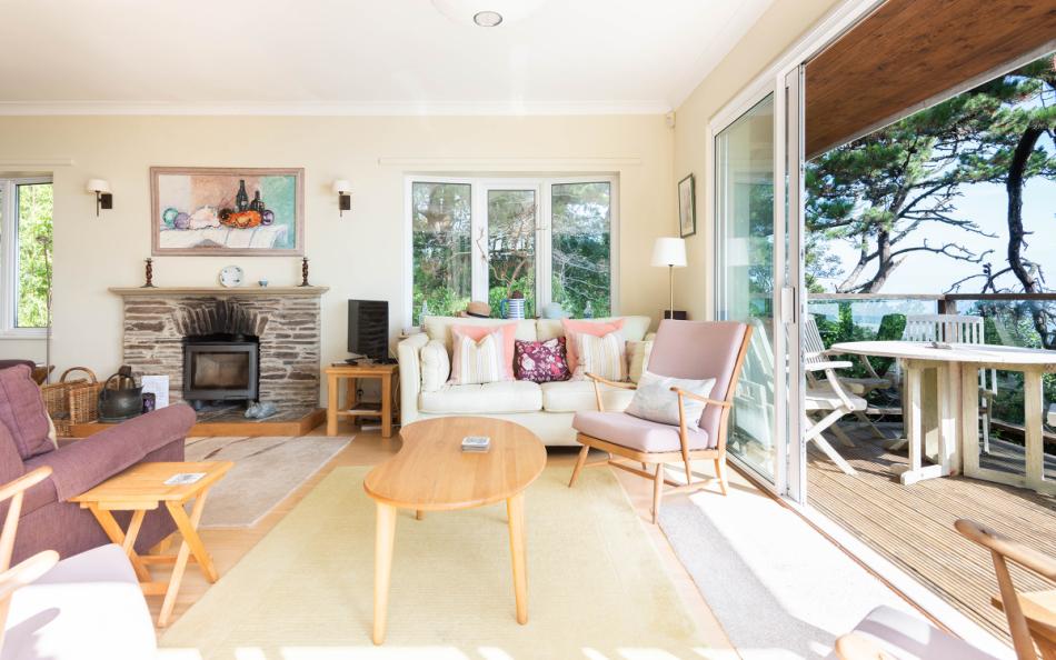 The comfortable lounge looking out of the patio doors to the garden and superb views at Fairyfield