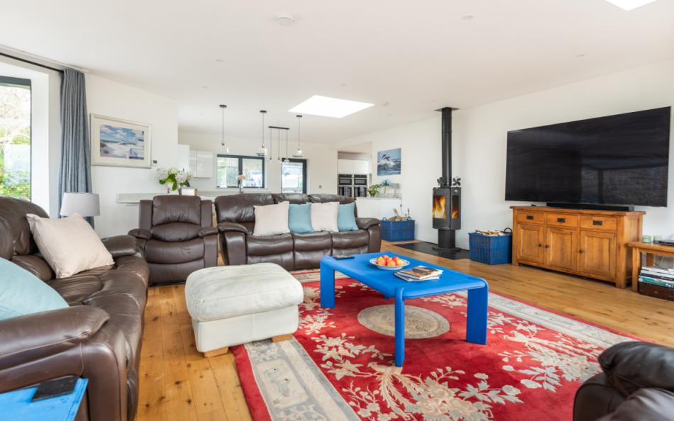woodburner and tv in lounge at Sea Haven House