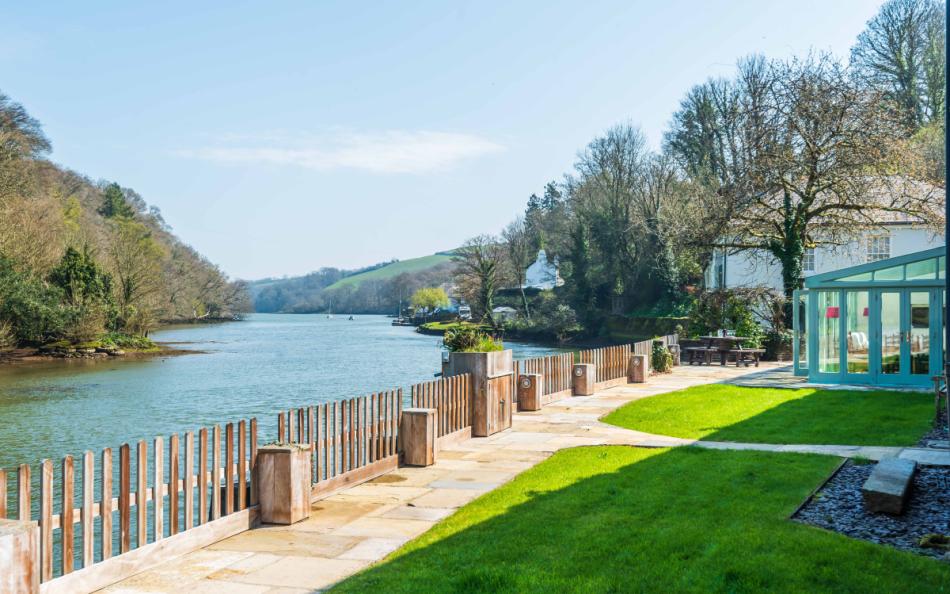 Perchwood Shippon and its tranquil setting by Bow Creek in Devon