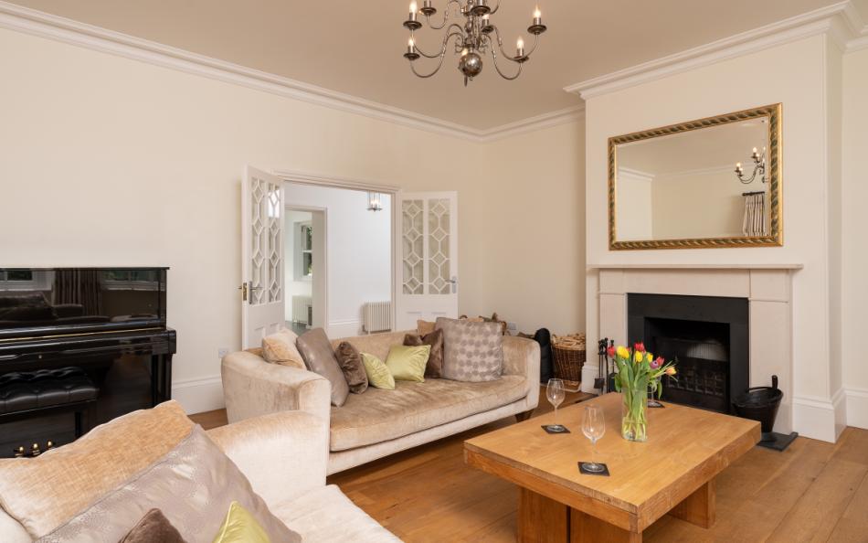 An open fire and piano at Holset House