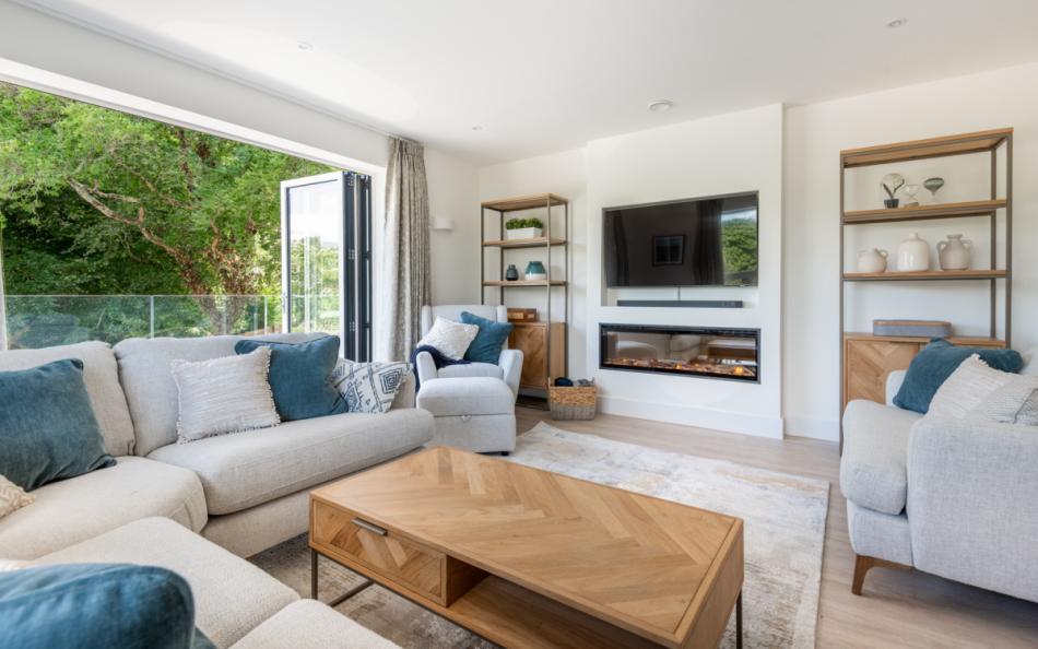 The first floor living room with balcony at Larkrise