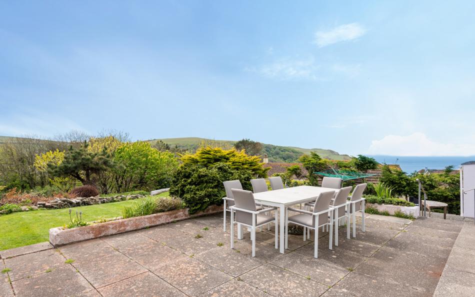 The patio with sea views at Devon House  
