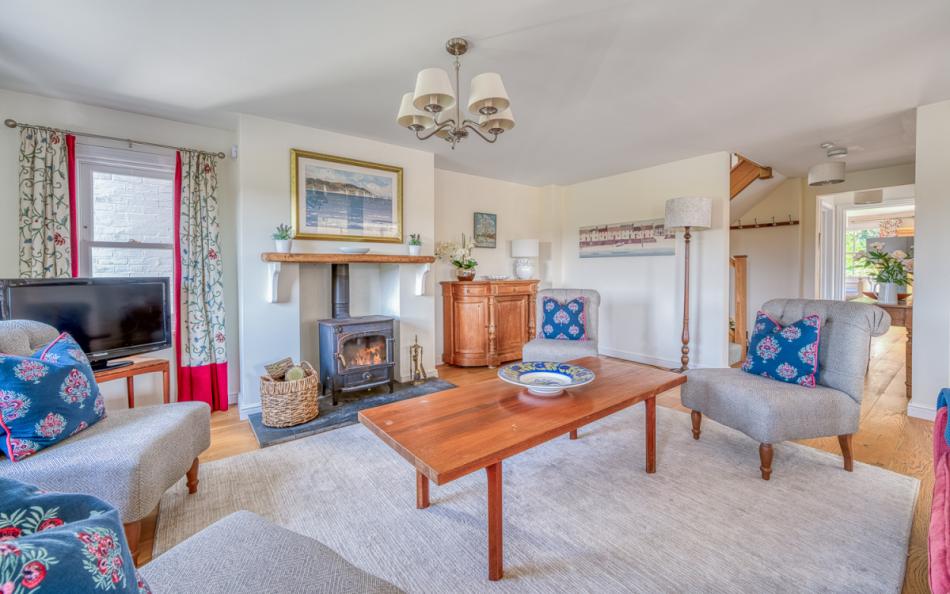 lounge with fire at Ivy Cottage