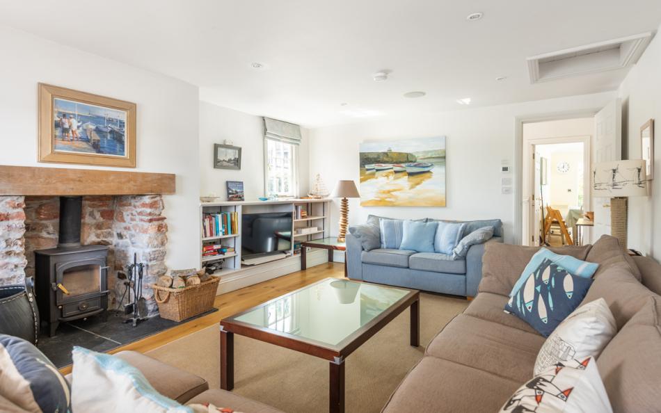 Separate sitting room with log burner at Dunedin Cottage