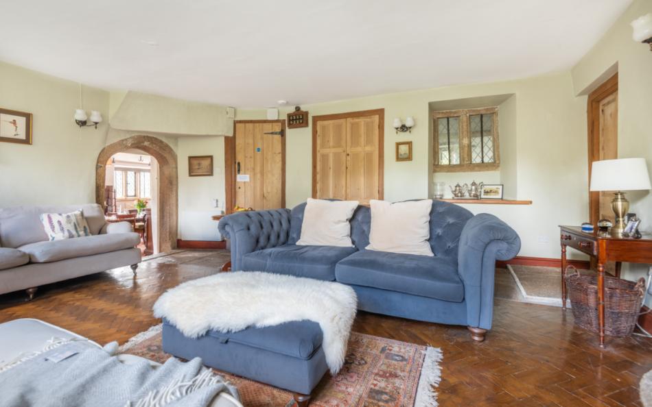 lounge with large sofas at Pengenna Manor