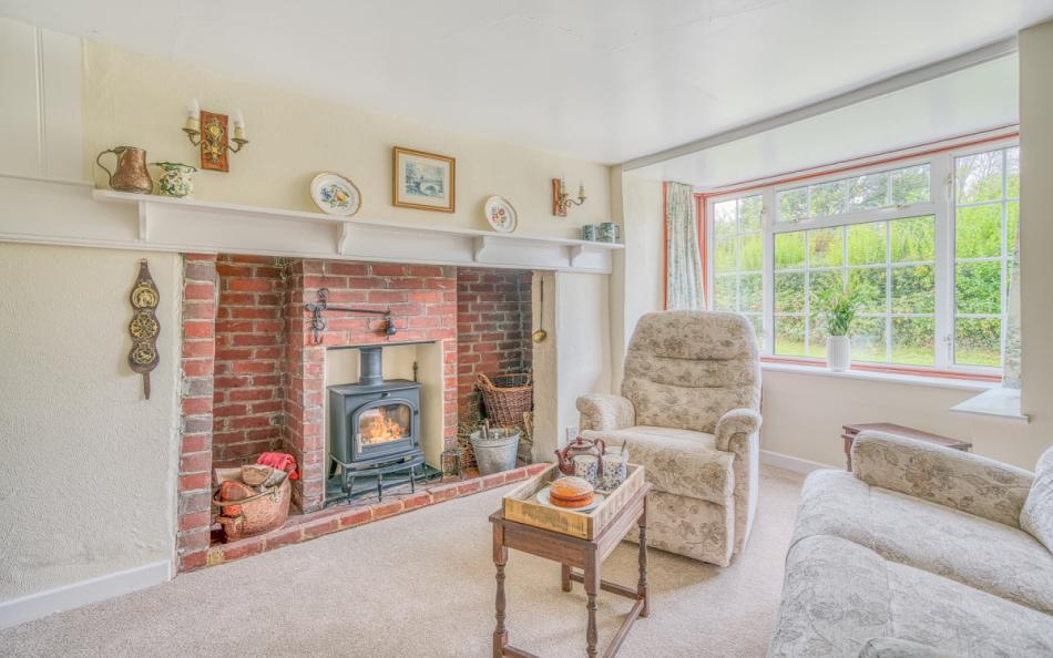 Lounge with woodburner at Brogenslade 