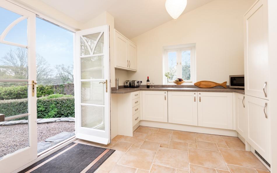 Patio doors lead to outside at Holne Chase Carriage House