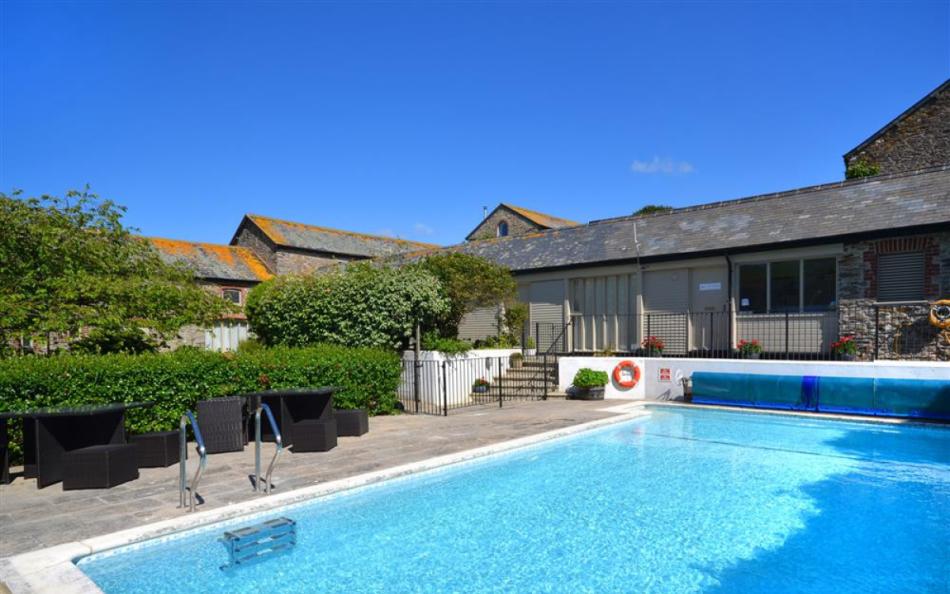 The heated outdoor swimming pool at Court Barton Loft