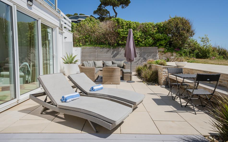 Patio and sun beds at Beach View