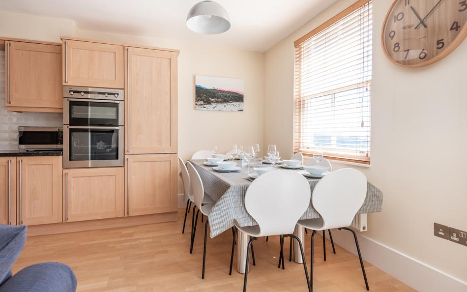 Open plan kitchen dining room seating for 8 at 11 Combehaven 