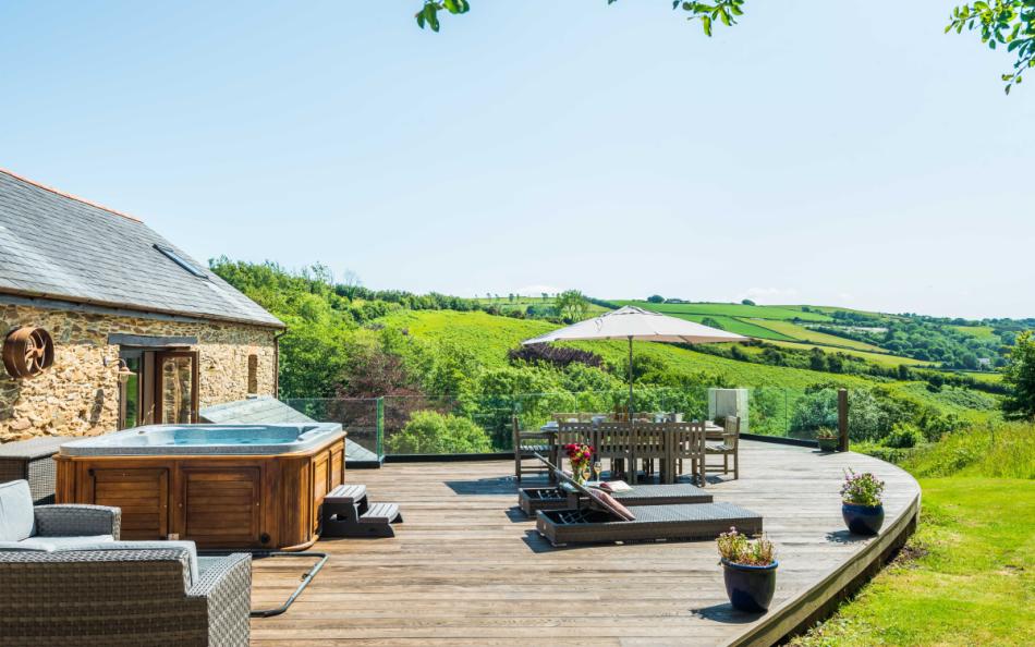 loungers and outdoor dining at The Old Barn 