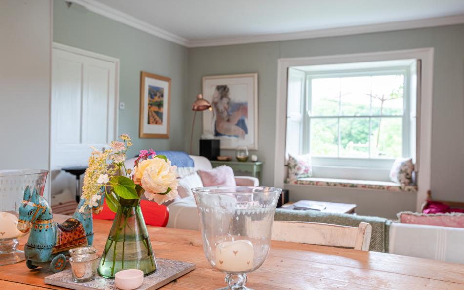 The dining table looking across to the living space at Dunstone Farm