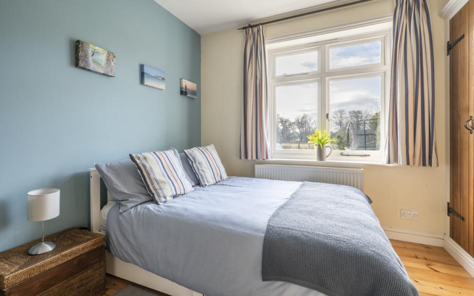 double bedroom with views at Heather Cottage