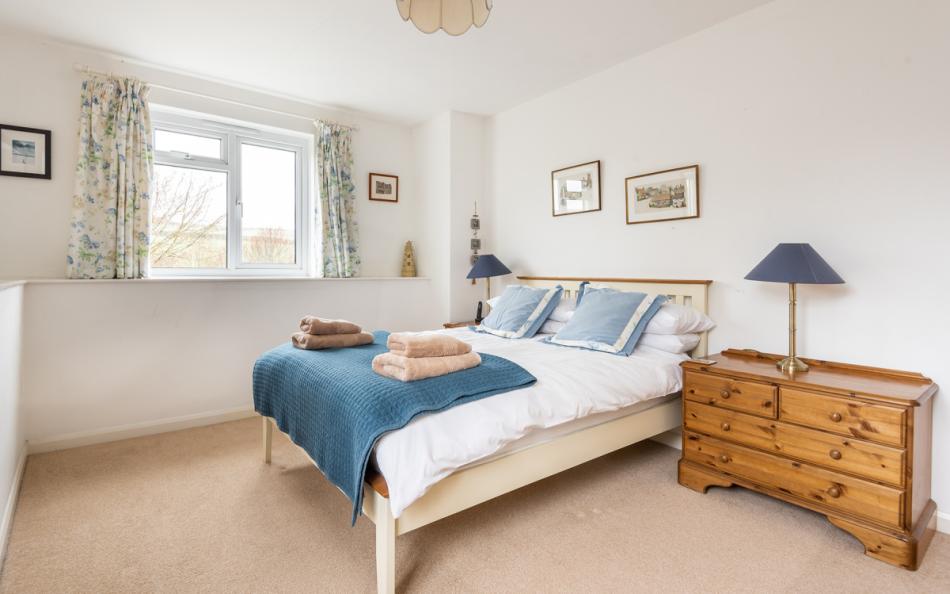 The light and airy main bedroom in the far wing at Orchard View 