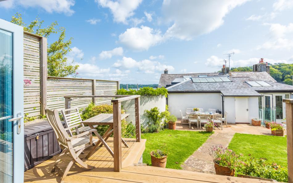 Studio's decked terrace with seating at Dunedin Cottage