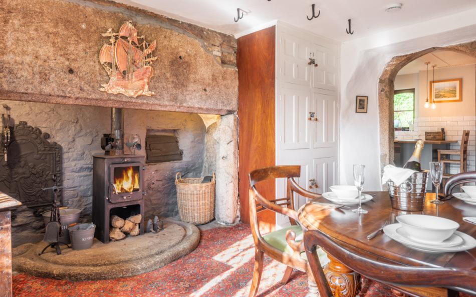 dining area with open fire at Pengenna Manor