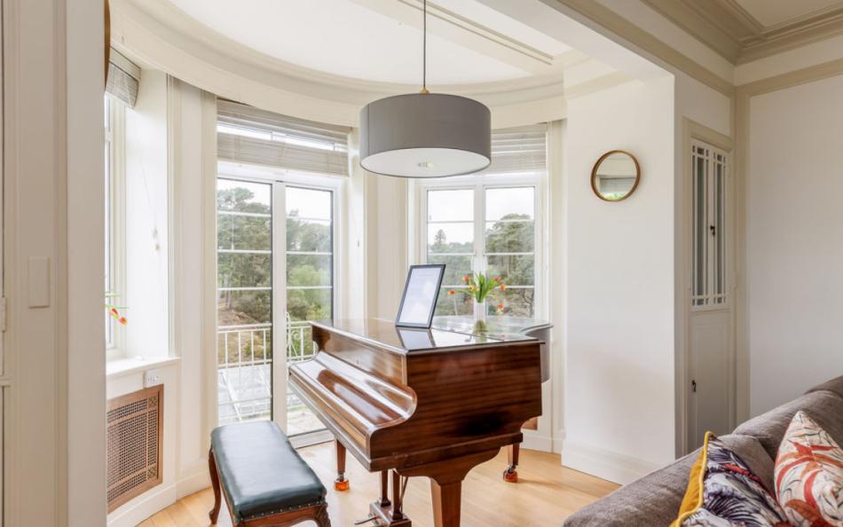 piano in window at Panorama House near Bournemouth