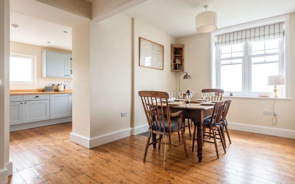 The dining area with sea views at 1 Ivy Cove