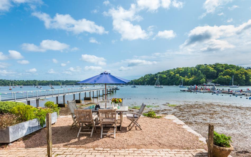 Front patio on the quayside with nearby steps to beach (at low tide) at Dunedin Cottage