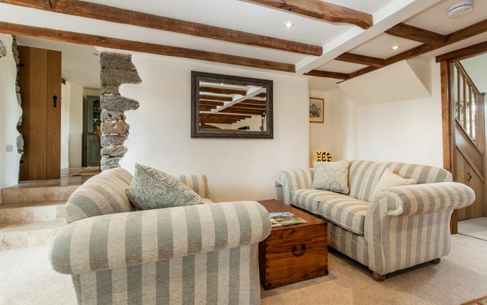 Two comfortable 2 seater sofas' in the adjoining seating area at Locks Farm 