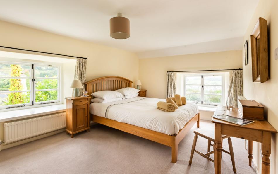 The spacious master bedroom which enjoys fabulous views at Dower House