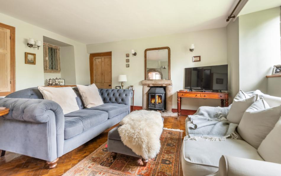 Drawing room with wood burner & smart TV at Pengenna Manor