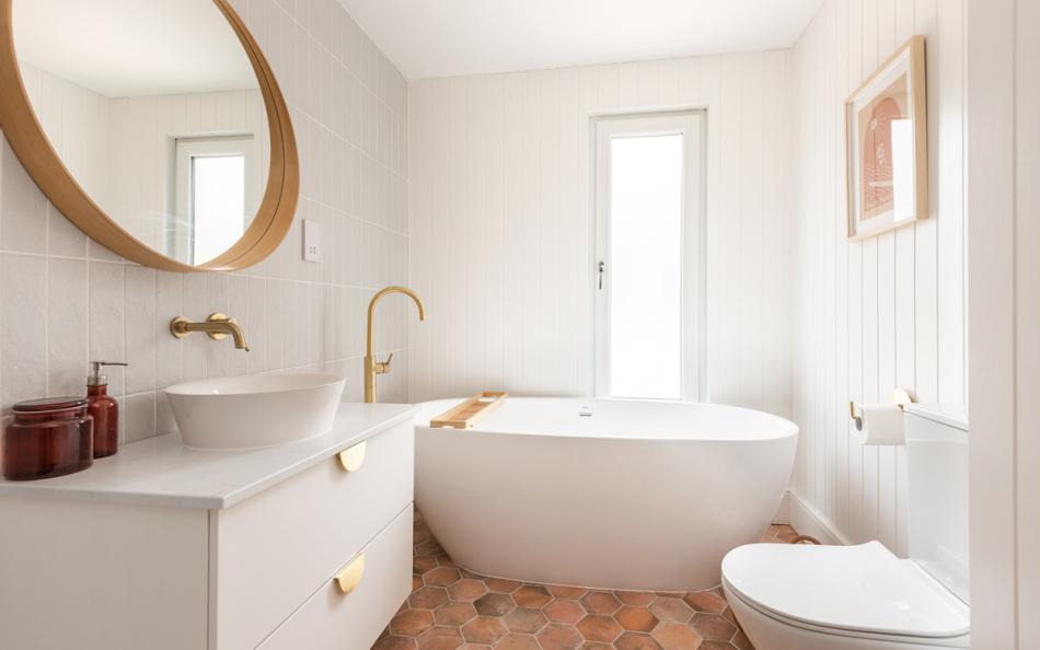 Family bathroom with freestanding bath and separate walk in shower at Craiglands
