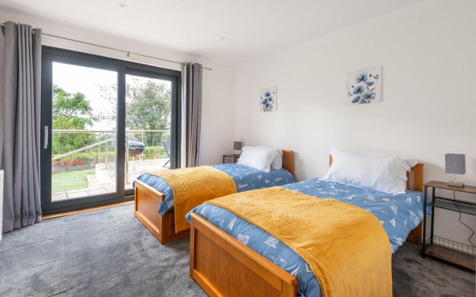 large twin bedroom at Sea Haven House