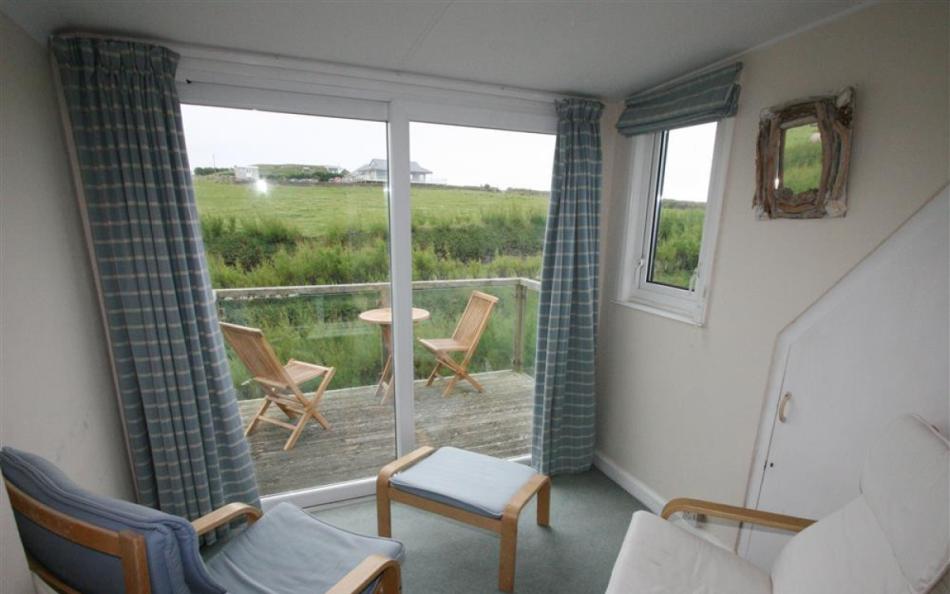Sitting area to superking bedroom at Roswidden on the cliff