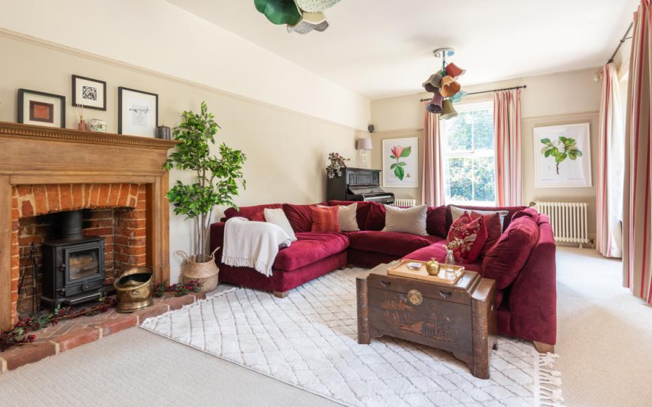 Cosy lounge with wood burner at Corner Cottage