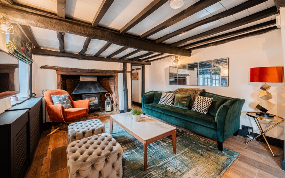 lounge with woodburner at Fiddlesticks Cottage
