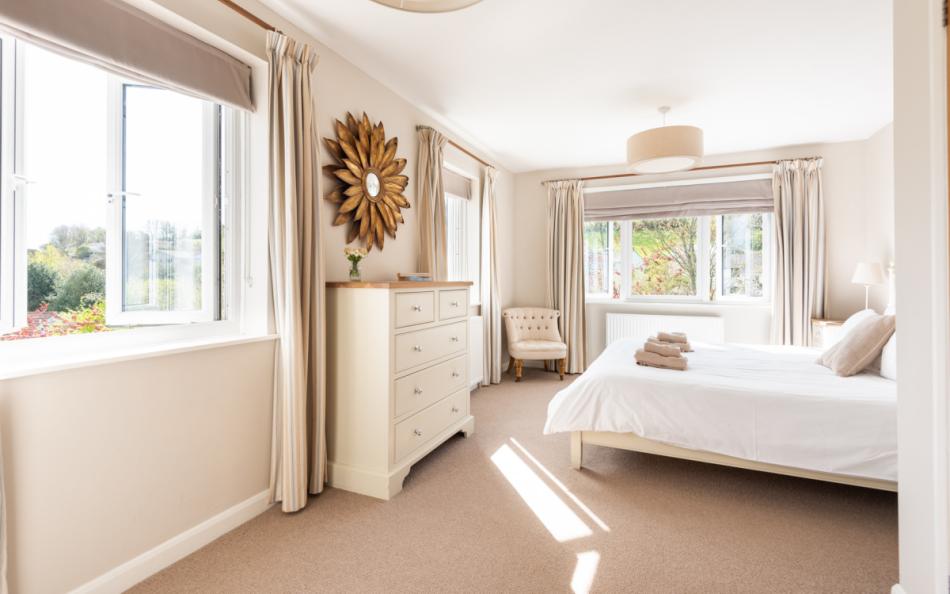 Master bedroom with en suite bathroom at Clover Cottage