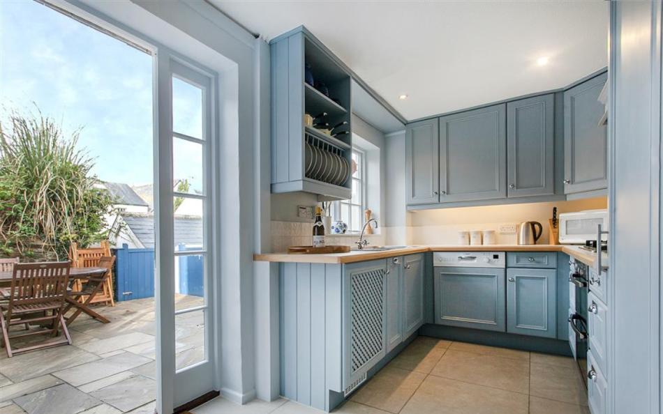 The kitchen with access to patio at 1 Kings Cottages