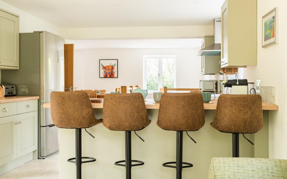 Breakfast bar seating in the kitchen at Clanacombe Lodge 