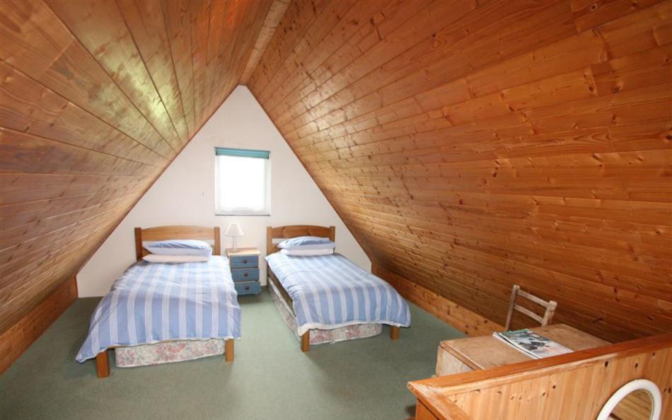 Annexe twin bedroom at Roswidden on the cliff
