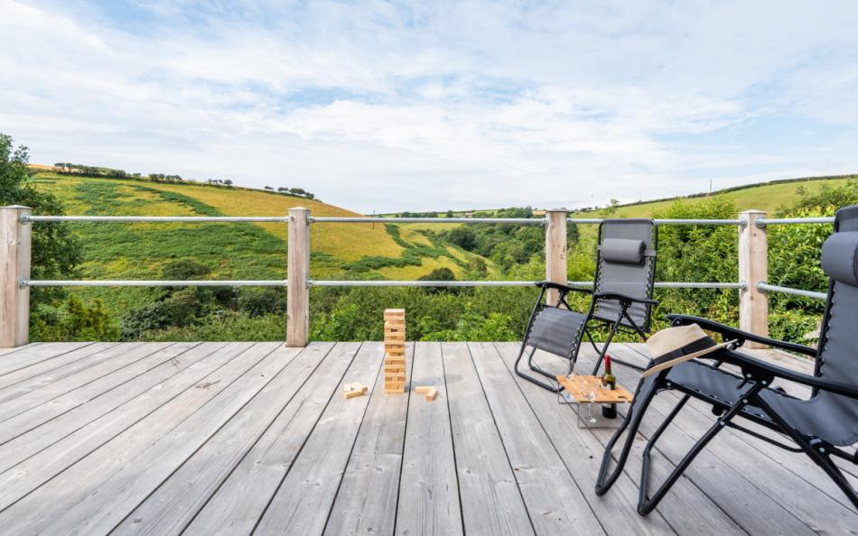 The spacious decked terrace with great rural hillside views