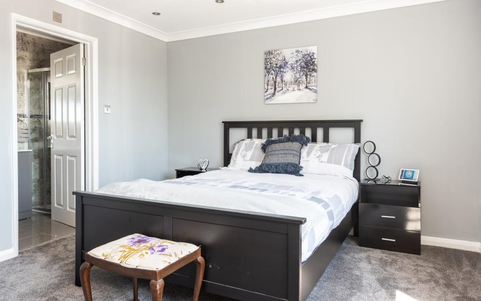 Another view of the spacious master bedroom at 1 Crestfields